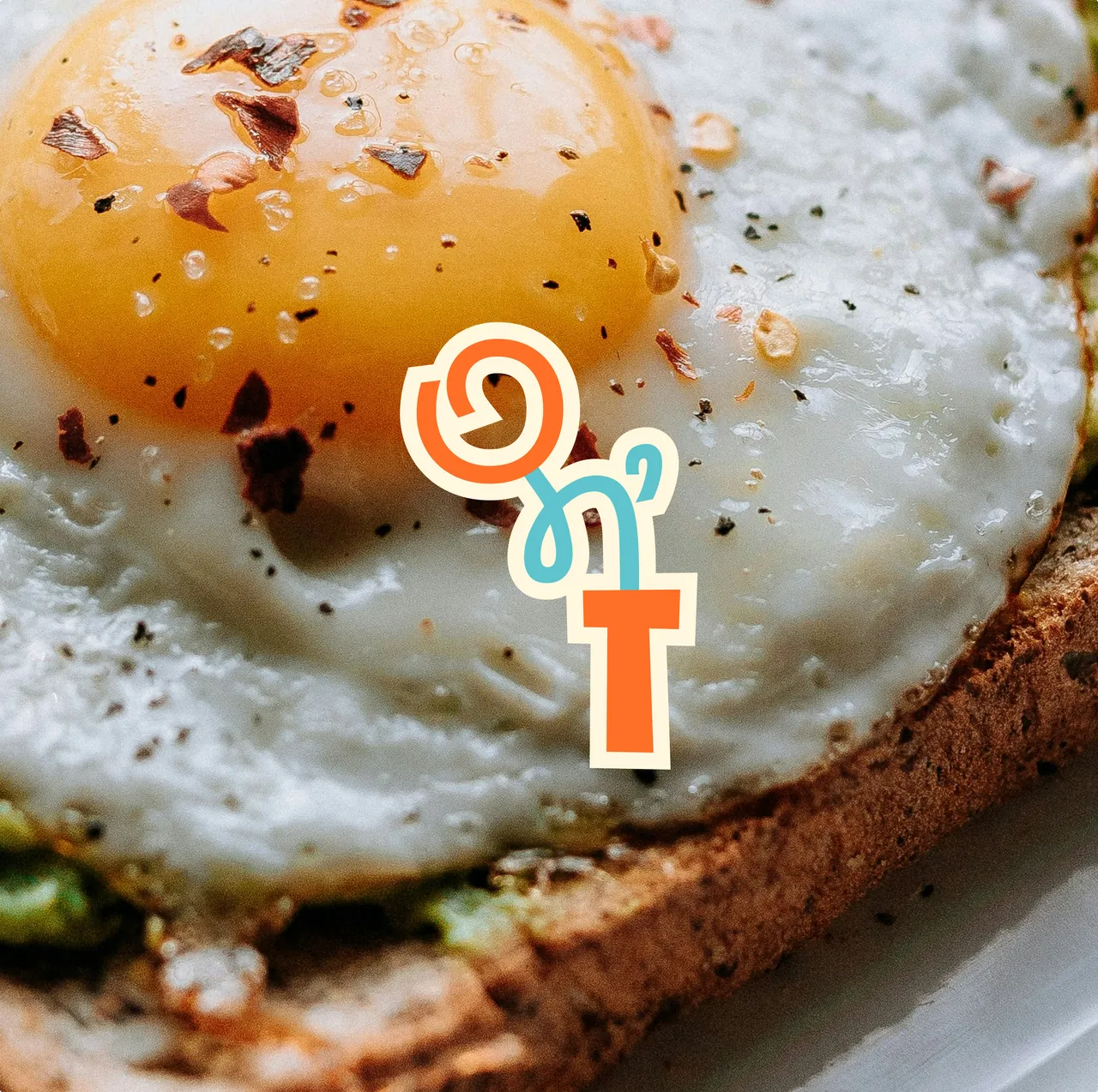 The Oats n&rsquo; Toast mark over a fried egg on toast